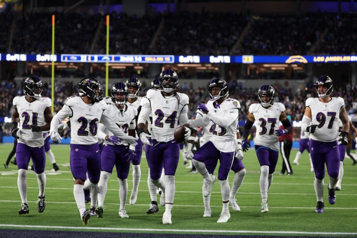 Baltimore Ravens linebacker Jadeveon Clowney (24) celebrates with his teammates after recovering a fumble against the Los Angeles Chargers during the fourth quarter at SoFi Stadium. Mandatory Credit: Kiyoshi Mio-USA TODAY Sports